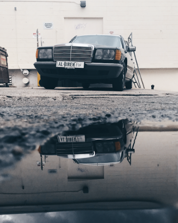 Reflection Photography of Black Car