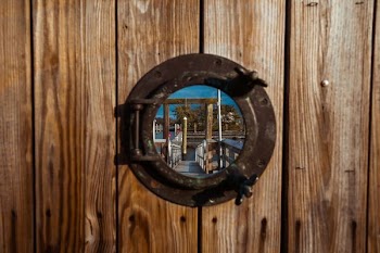 reflection photography of brown wooden dock