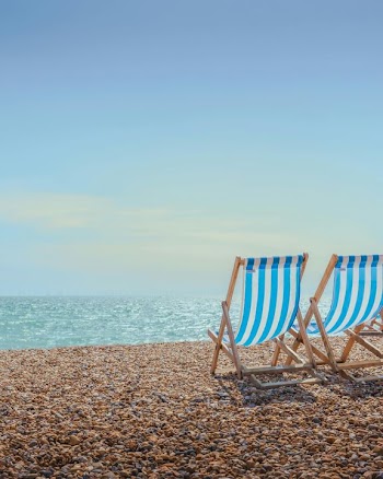 Relaxing Beachfront with Deck Chairs
