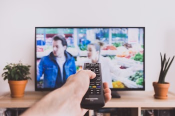 Remote control pointed at a TV screen 2