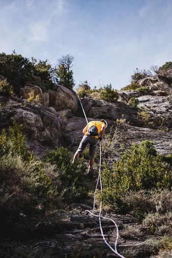 Repelling A Rock Face
