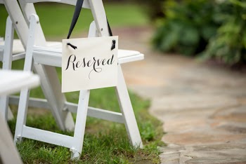Reserved Signage Hanging On Chair