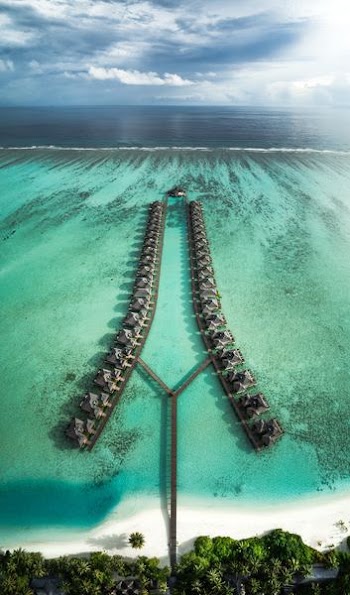 Resort extends out across the coral reefs of a Maldivian island