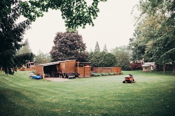 Riding Mower At Rest On Lawn