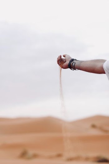right person hand holding sand