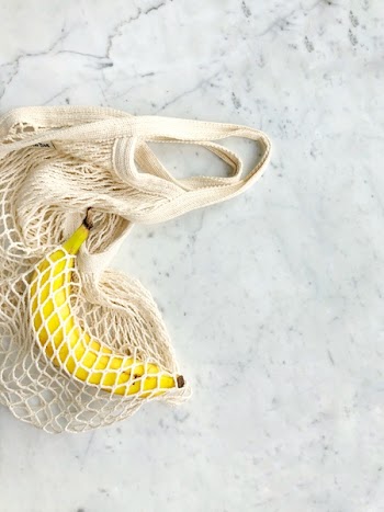 Ripe Banana in White Knitted Bag