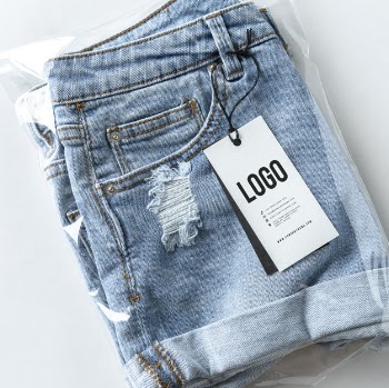 Ripped jean shorts with a tag mockup Free Psd