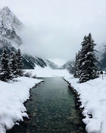 river at glacier mountain with fogs
