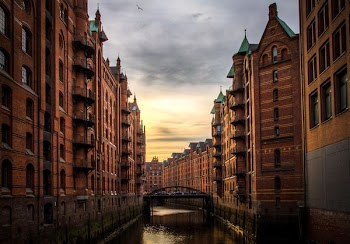 river between brown concrete buildings