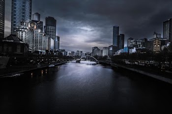 river in between high-rise concrete buildings