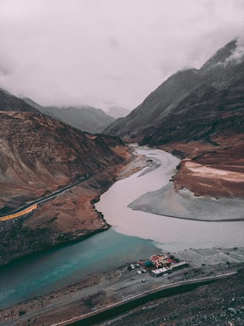 River in Between Two Roads