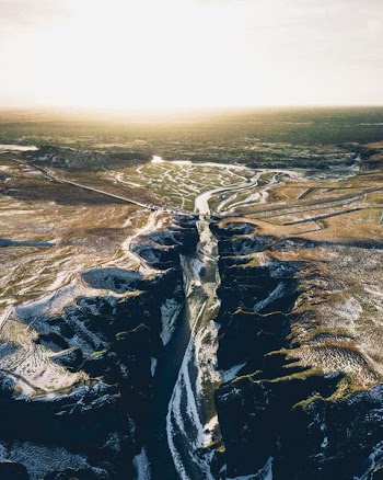 river surrounded by moutnains
