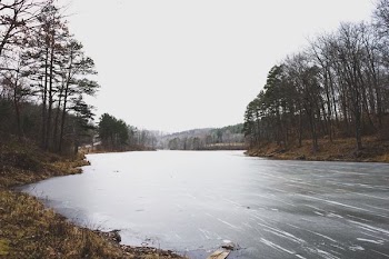 river under cloudy sky during daytime
