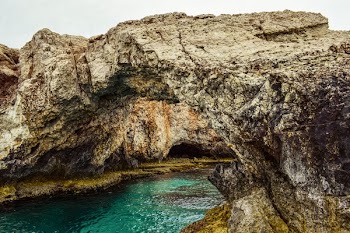 Rock Cliff Near Body of Water