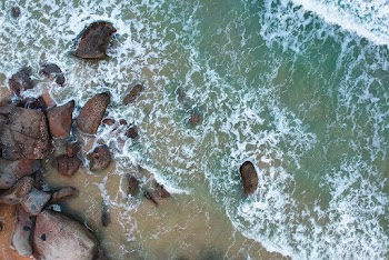 Rock Formation Beside Body of Water