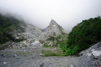 rock formation covered with mist