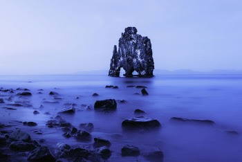 Rock Formation in Middle of Body of Water