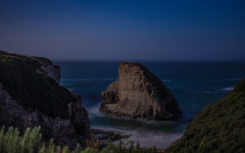 Rock Formation in the Middle of Body of Water