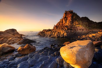 Rock Formation Near Body of Water