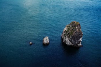 rock formation on body of water