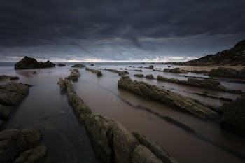 rock formation on body of water