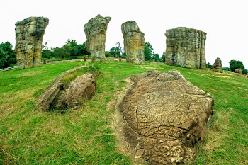 Rock Formation On Green Grass