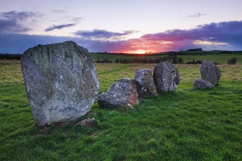 Rock Formation on Green Grass Field
