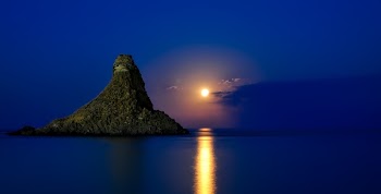 Rock Formation on Sea during Dawn
