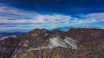 rock mountain under blue sky