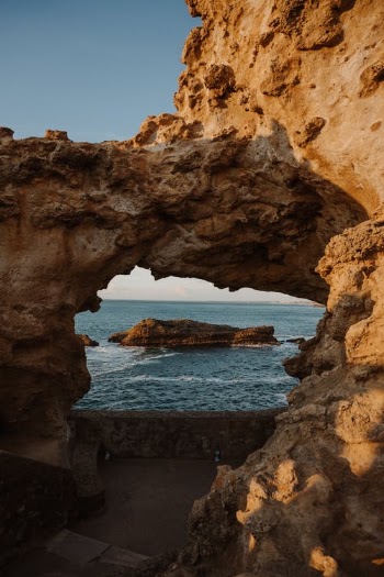 Rocks Forming Arch on Beach · Free Stock Photo