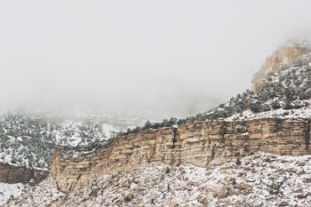 rocky mountain under gray sky at daytime
