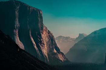 rocky mountain with fog