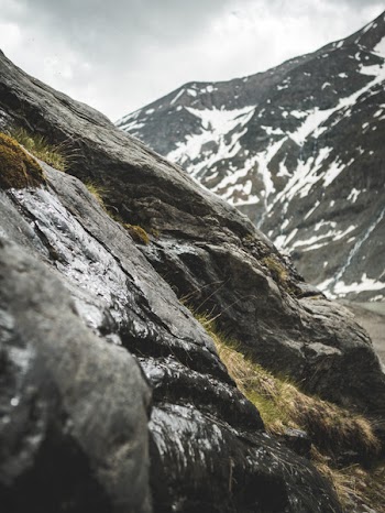 Rocky Mountain With Green Grasses at Daytime