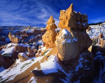 Rocky Mountain With Ice on Top Under Blue Cloudy Sky during Day Time