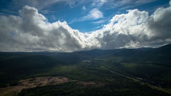 Rolling Couds Over Peaks And Valleys