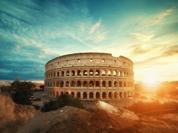 Roman Colosseum, Italy under clear sky during golden hour