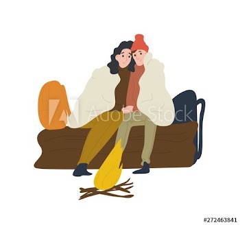Romantic couple sitting on log and warming up near campfire