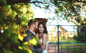Romantic Couple Standing Near A Gate