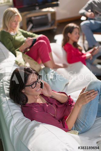 Roommates hanging out on sofa in living room