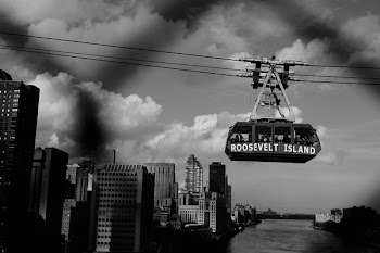 Roosevelt Island cable car on cable greyscale photography during daytime