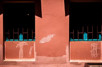 Rose wall and blue windows