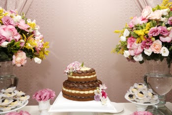 Round 2-layer Chocolate Cake Beside Two Assorted Flower Bouquet 
