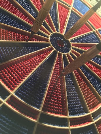Round Black and Red Dart Board