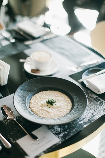 Round Black Ceramic Plate Filled With Food