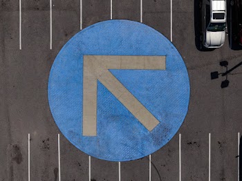 Round Blue and Gray Arrow Symbol
