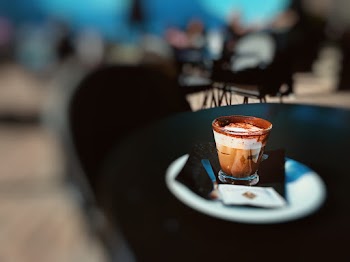 Round Brown and White Cup on Round White Saucer