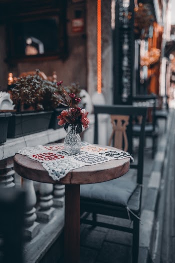 Round Brown Table With Flowers