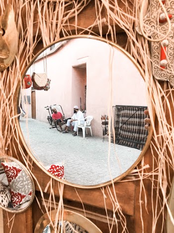 Round Framed Mirror On Wall