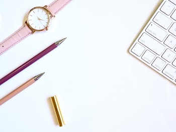 Round Gold-colored Watch and Two Pens