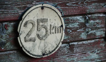 Round Gray 25 Km Signage